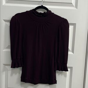 Dear John Ribbed Mock Ruffle Neck Puff Sleeve Top in Plum